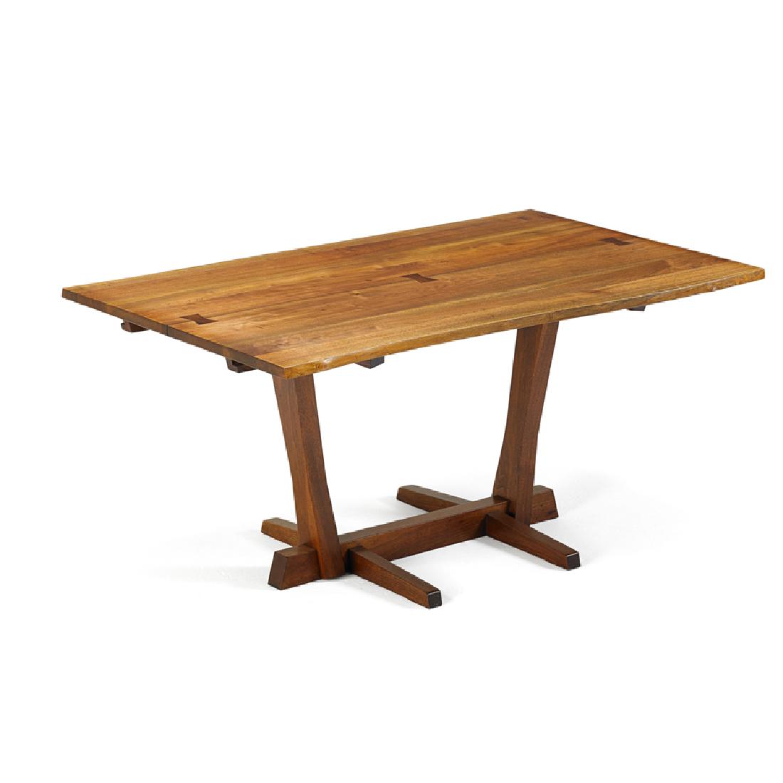 GEORGE NAKASHIMA Conoid dining table: GEORGE NAKASHIMA (1905 - 1990) NAKASHIMA STUDIO Conoid dining table, New Hope, PA, 1963 Persian walnut, rosewood Signed with client name 28 1/2" x 60" x 37 1/2", two leaves: 15" ea. Provenance: Copy o