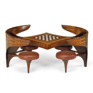 MICHAEL COFFEY Tête-à-Tête game table: MICHAEL COFFEY Tête-à-Tête game table, Massachusetts, 1986 African mozambique, ebony, holly, leather, leather and marble game pieces Signed and dated 35" x 77" x 67", to seats: 19", to table top: