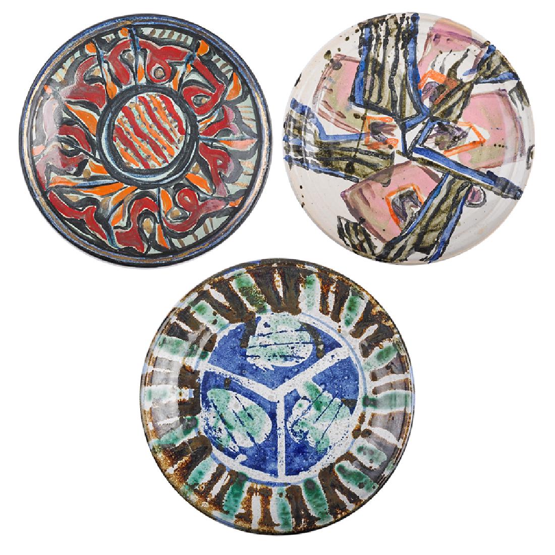 KA-KWONG HUI Three plates: KA-KWONG HUI (1922 - 2003) Three plates with abstract designs, USA Glazed and cold-painted earthenware All signed Largest: 10 1/2" dia. Provenance: Estate of the artist