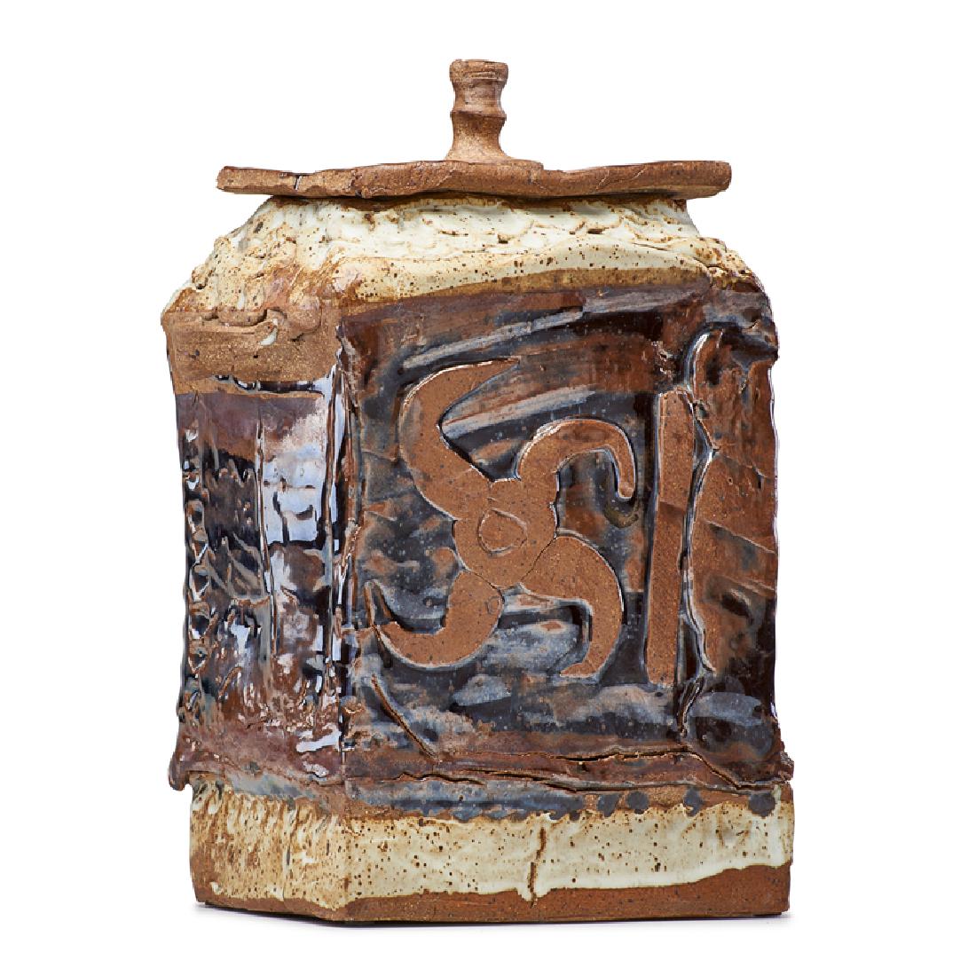 RUDY AUTIO Large lidded vessel: RUDY AUTIO (1926 - 2007) Large lidded vessel with applied decoration, iron oxide glaze, Missoula, MT, 1966 Hand-built glazed stoneware Signed and dated 15" x 9" Provenance: Rago Auctions, Modern Ceram