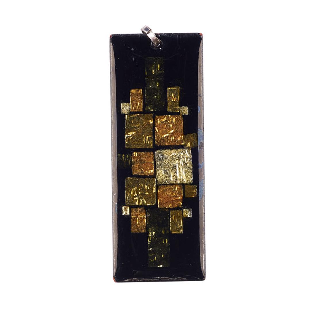 WIENER WERKSTATTE PENDANT: A geometric foil design on black enamel ground. With original stickers on reverse. 2 3/4" x 1".