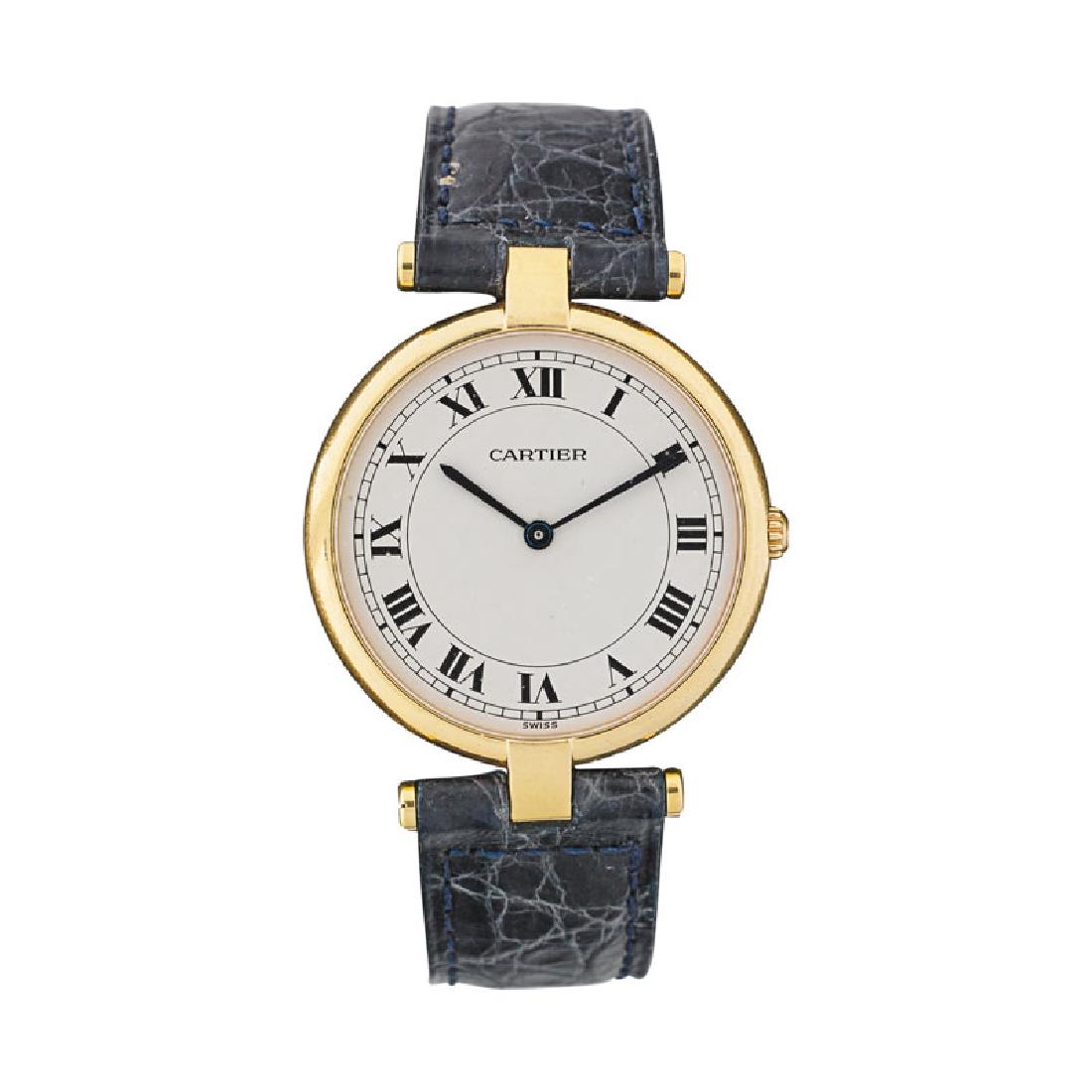 LADY'S CARTIER GOLD WRISTWATCH: The cream dial with Roman Numeral hour and dash minute markers, blue arrow head hands, Swiss gilt steel, Swiss made Cartier quartz movement #881, in round 18k case, and sapphire crown, non gold foldov