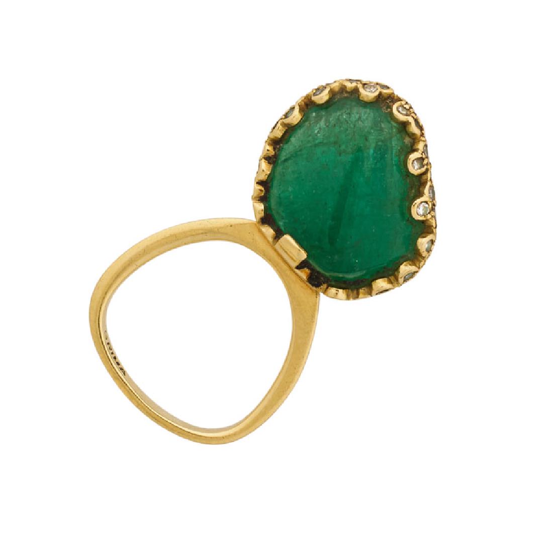 ANDREW GRIMA EMERALD, DIAMOND & YELLOW GOLD RING: A vertically set polished emerald pebble, 16.1 x 17.7 x 9.8 mm, in a frame of staggered bezel set single-cut diamonds, approx. .25 ct. TW, on a gold hoop. 1968. 18k. Stamped Grima, H.J. Co. with Engli