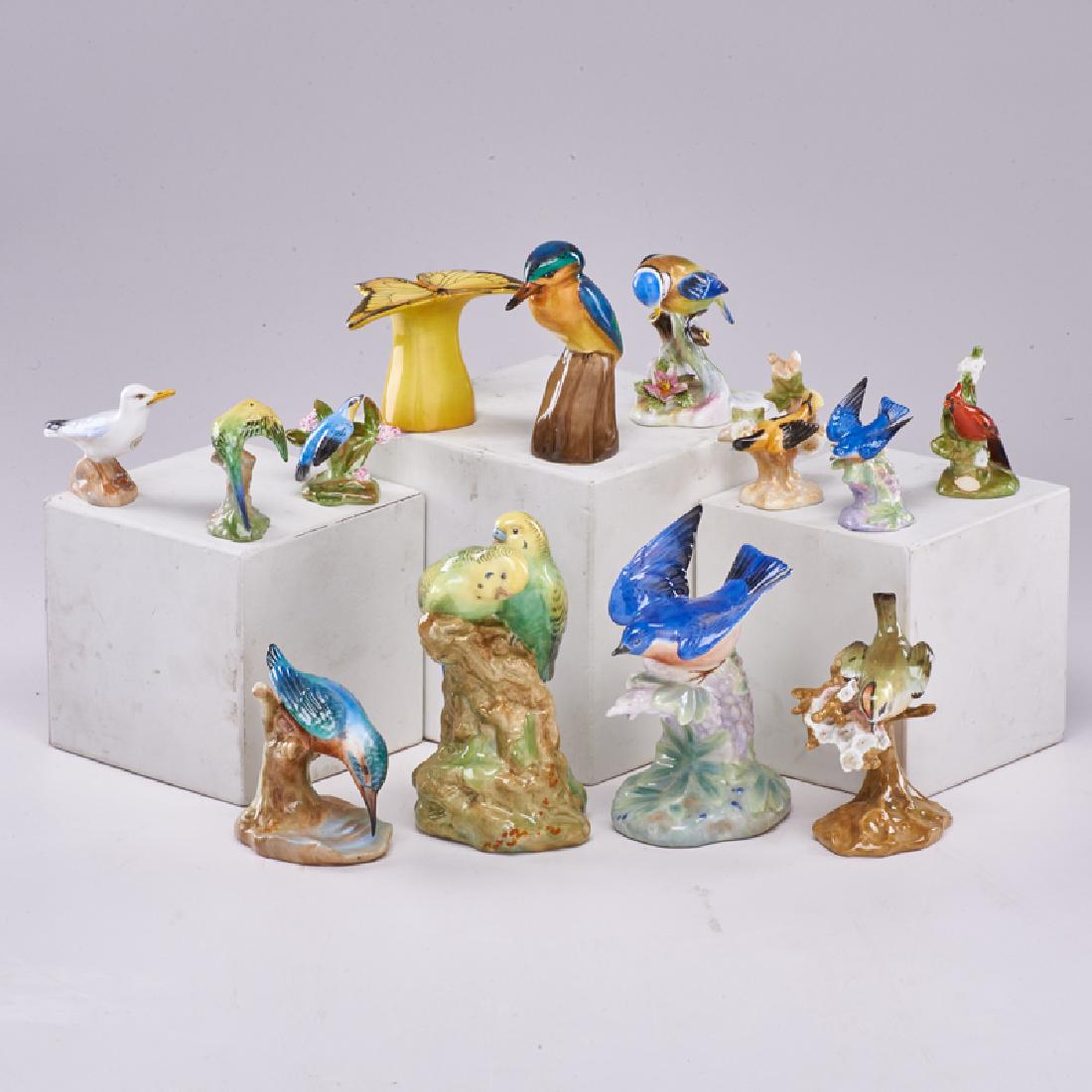 ROYAL DOULTON: Thirteen avian figurines: two Blue Bird, two Budgerigar, Gold Crested Wren, King Fisher, Cardinal, Seagull, Blue Tit, Yellow Throated Warbler, Baltimore Oriole, etc., England, 20th c. All with Royal D