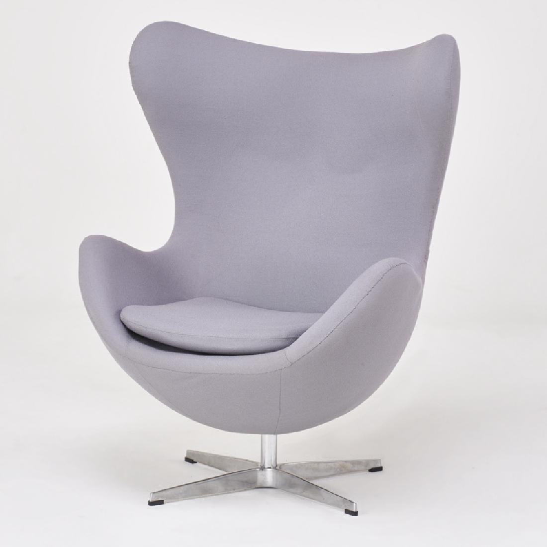 STYLE OF ARNE JACOBSEN: Tilt swivel lounge chair, 2000s Polished aluminum, chromed steel, upholstery Unmarked 42 1/2" x 31" x 32"