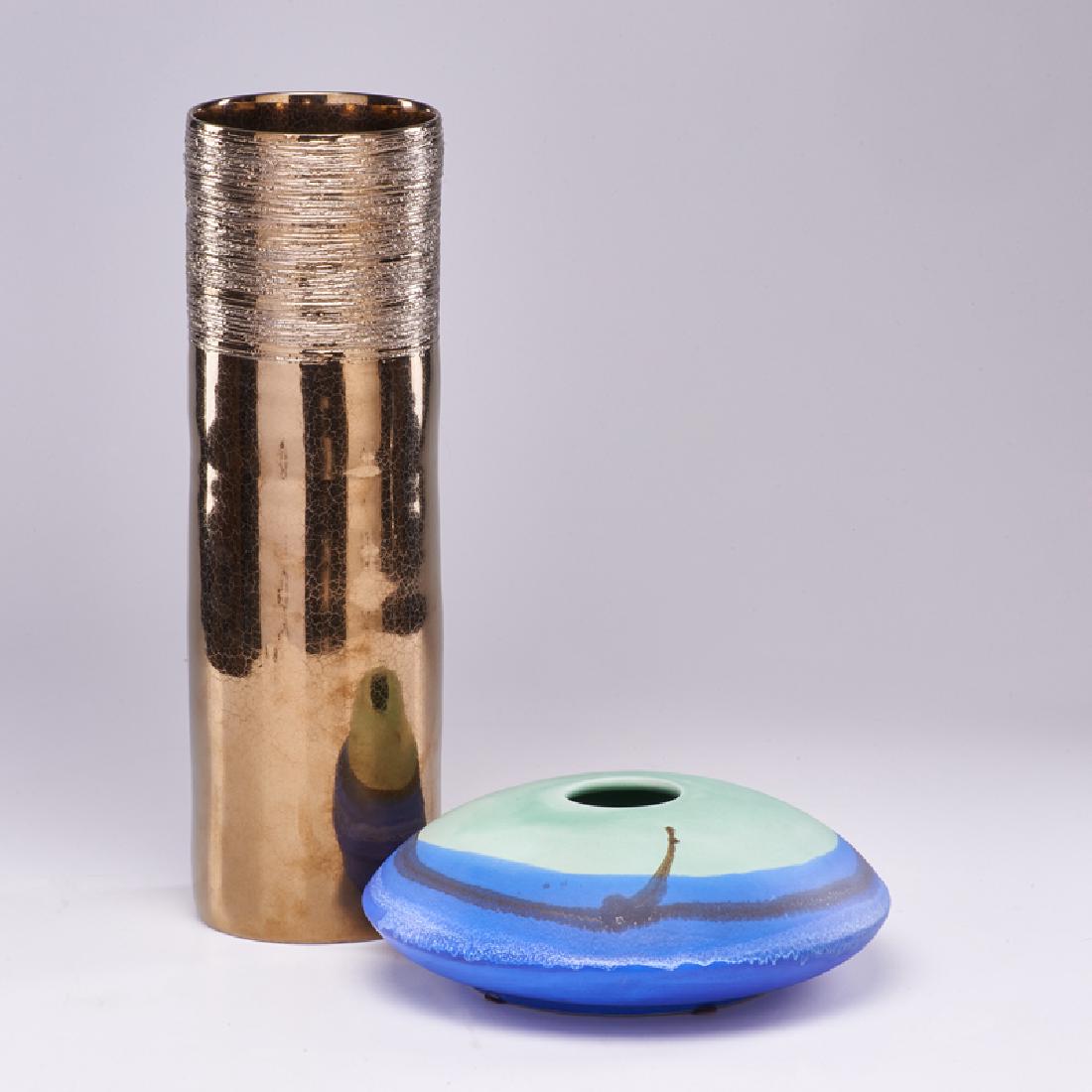 RAYMOR, ETC.: Two glazed ceramic pieces: matte polychrome squat vessel, and cylindrical vase in metallic glaze, Italy/USA/Portugal, mid-late 20th c. Raymor paper label, other labeled Made in Portugal Taller: 16 1/2