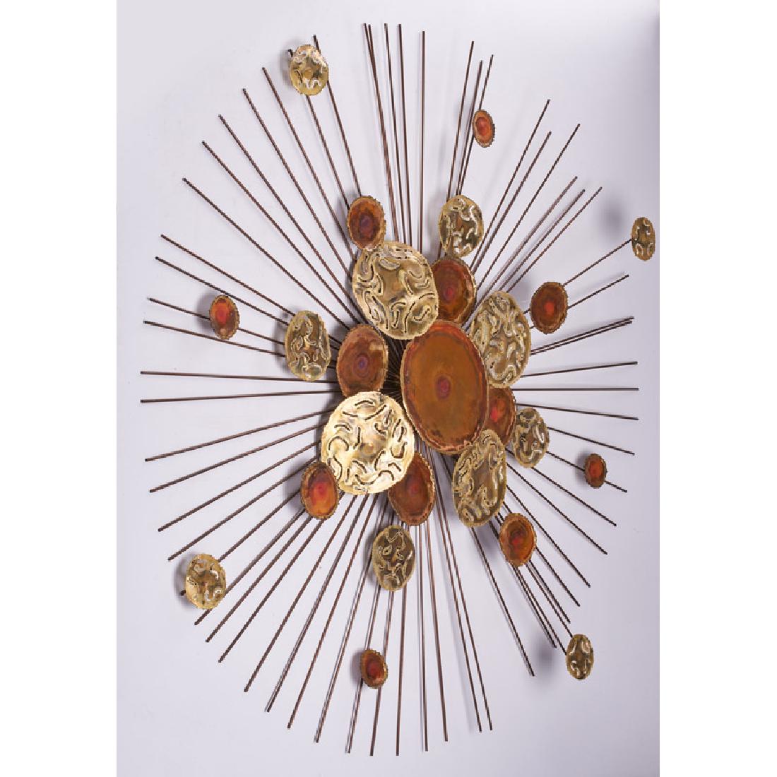 STYLE OF C. JERE: Wall-hanging starburst sculpture with applied, treated, and pierced disks, 2000s Brass, copper Marked VA, numbered and dated to back 38 1/2" dia.