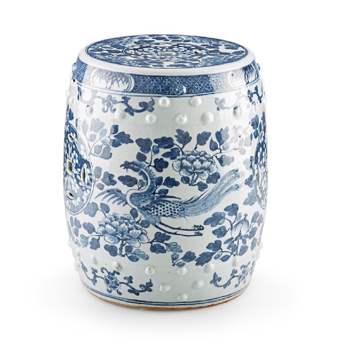 DIMINUTIVE CHINESE PORCELAIN GARDEN STOOL: Decorated with blue and white foliate design and phoenixes, China, 19th c. 12" x 9" dia.