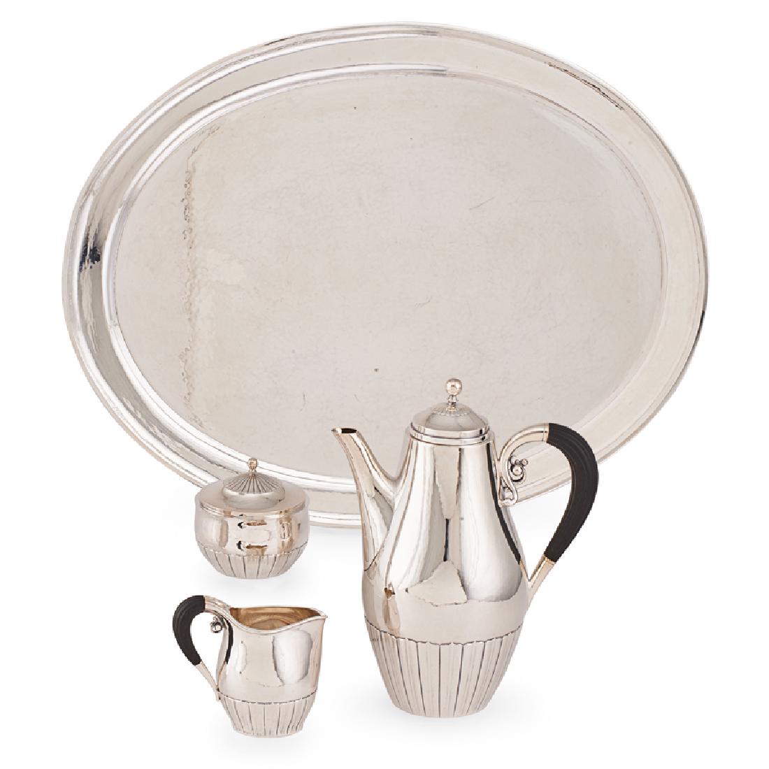 GEORG JENSEN STERLING SILVER COFFEE SERVICE: Four: "Cosmos" pattern designed by Johan Rohde, coffee pot, covered sugar, creamer, and associated Jensen tray, no. 45A, D, and E and 223K, Denmark, 1945-77 Marked Pot: 9 1/2" 75.7 OT (total weight)