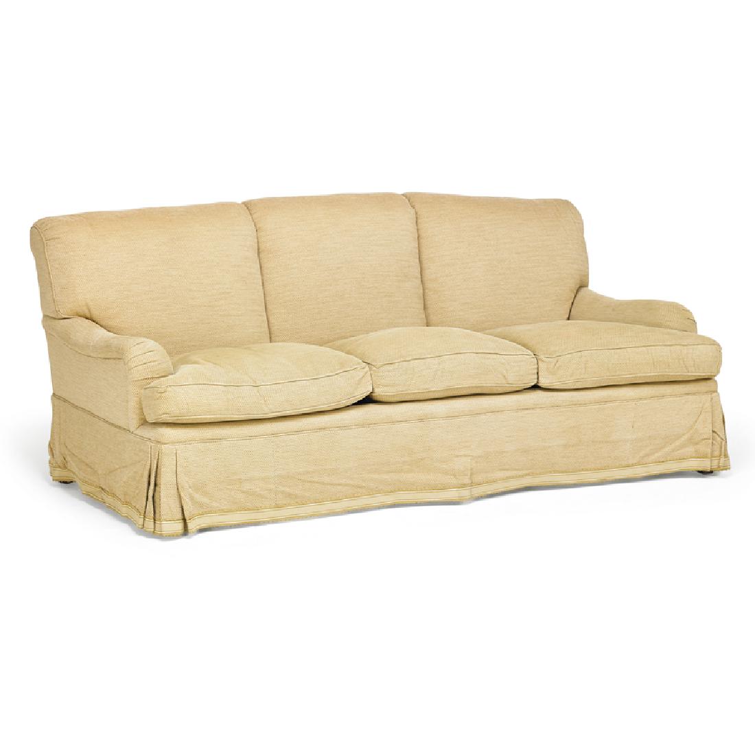 CONTEMPORARY UPHOLSTERED SOFA: Three-seat, beige upholstery, USA, 20th c. 32" x 84" x 36" Provenance: From a private New York residence appointed by Bunny Williams