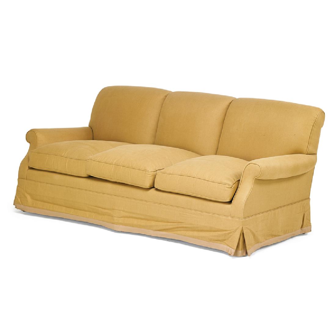 CONTEMPORARY UPHOLSTERED SOFA: Three-seat, tan upholstery, USA, 20th c. 33" x 76" x 35" Provenance: From a private New York residence appointed by Bunny Williams