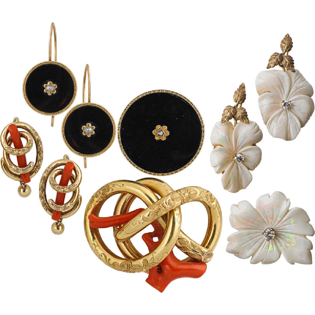 GROUP OF YELLOW GOLD HALF SUITES: Comprising three half suites, each with a brooch and pair of earrings, including 14k Algerian knots with branch coral, 14k onyx disks with seed pearl rosettes or carved opal blossoms with RBC diamonds