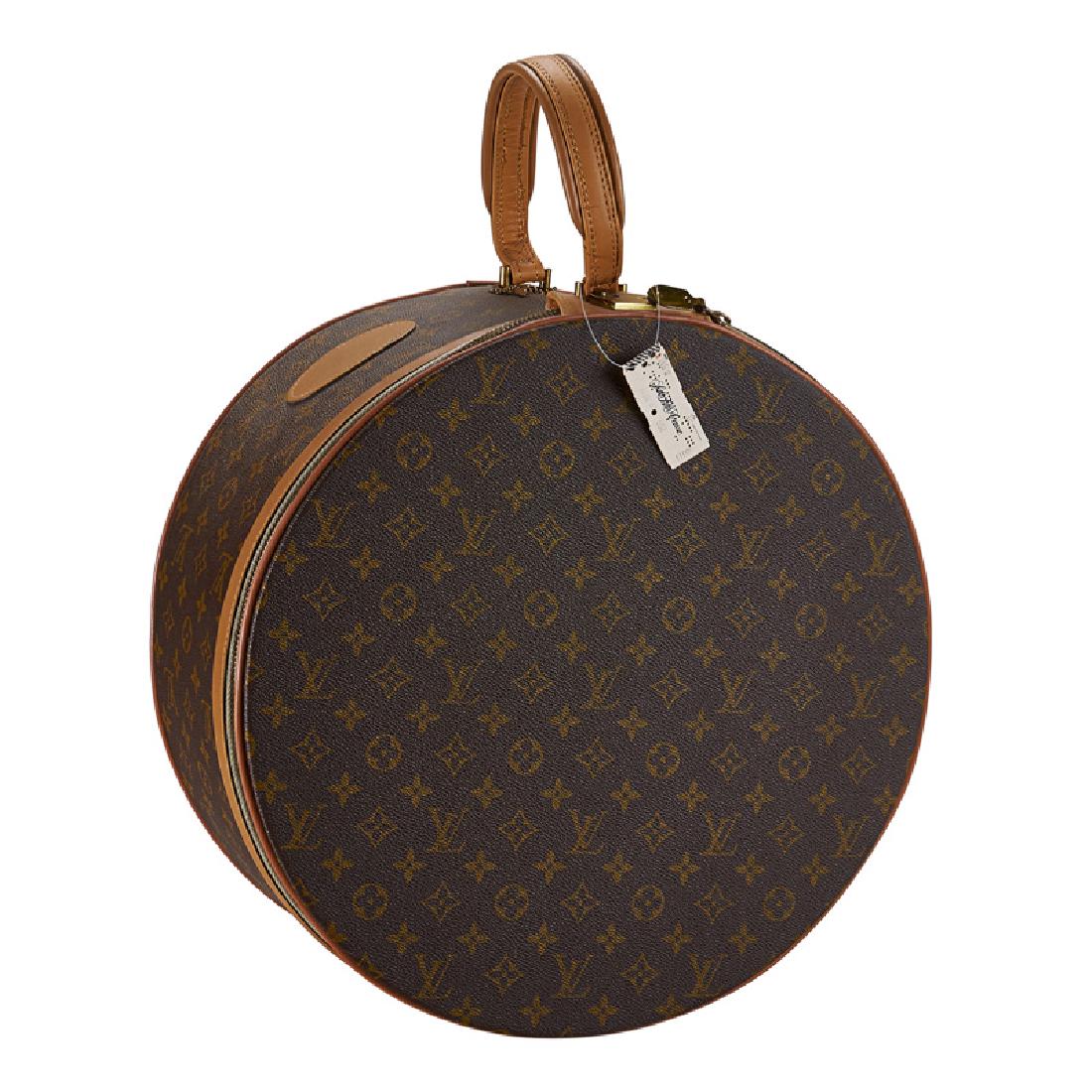 LOUIS VUITTON "MONOGRAM CANVAS" HAT BOX: With original Saks 5th Ave. tag and label. 15 1/2" x 15 1/5" x 7", handle 5 1/2".