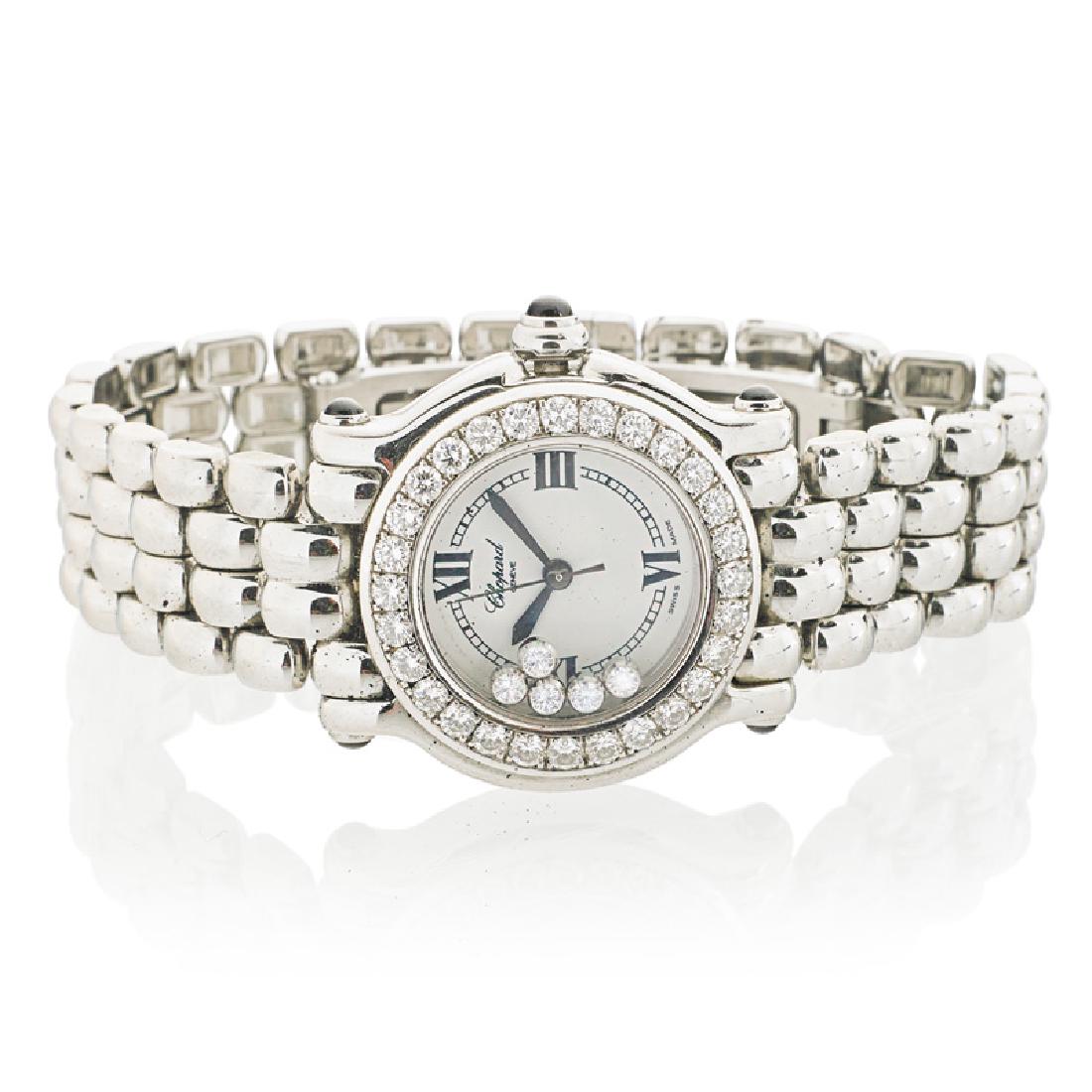 LADY'S CHOPARD HAPPY SPORT STEEL & DIAMOND QUARTZ WATCH: The round white dial with five floating RBC diamonds and RBC diamond bezel approx. 1.50 cts. TW, black hands and Roman numeral hour markers. Scratch resistant sapphire crystal. Blue sapphire cabochon