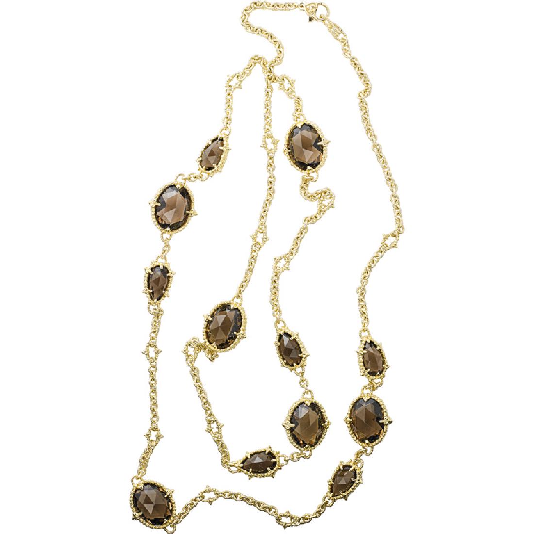 JUDITH RIPKA SMOKY TOPAZ & YELLOW GOLD LONG CHAIN: The spectacle set pear or oval faceted smoky topaz on textured link chain. 18k. Stamped JR. 34". 39.2 dwt.