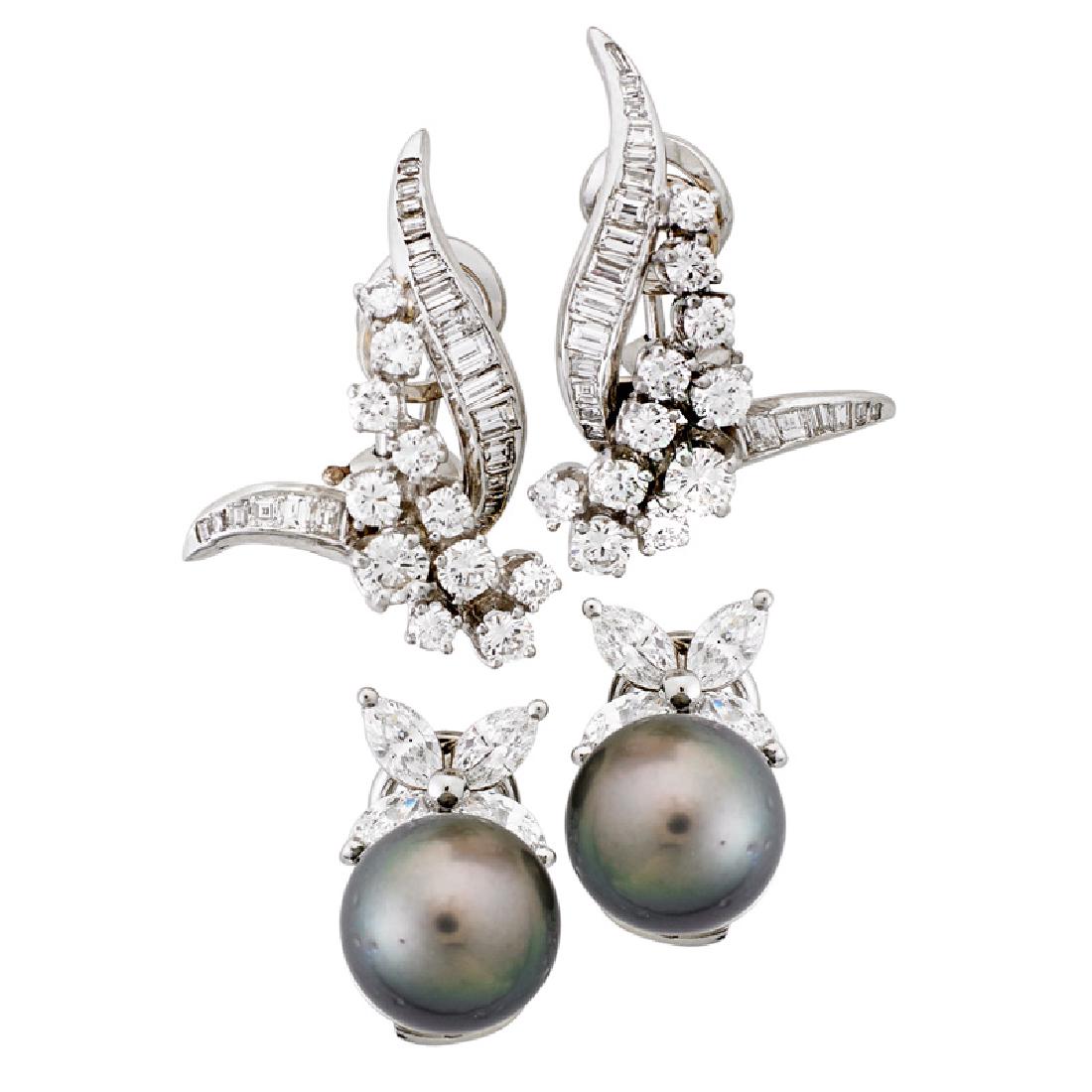 TWO PAIRS OF DIAMOND OR PEARL & PLATINUM EAR CLIPS: A pair of upswept cascade and ribbon RBC diamond clusters; A pair of marquise cut diamond clusters with 11.25mm Tahitian black pearls. Diamonds approx. 4.50 cts. TW throughout. 1960-2000. One stamped 