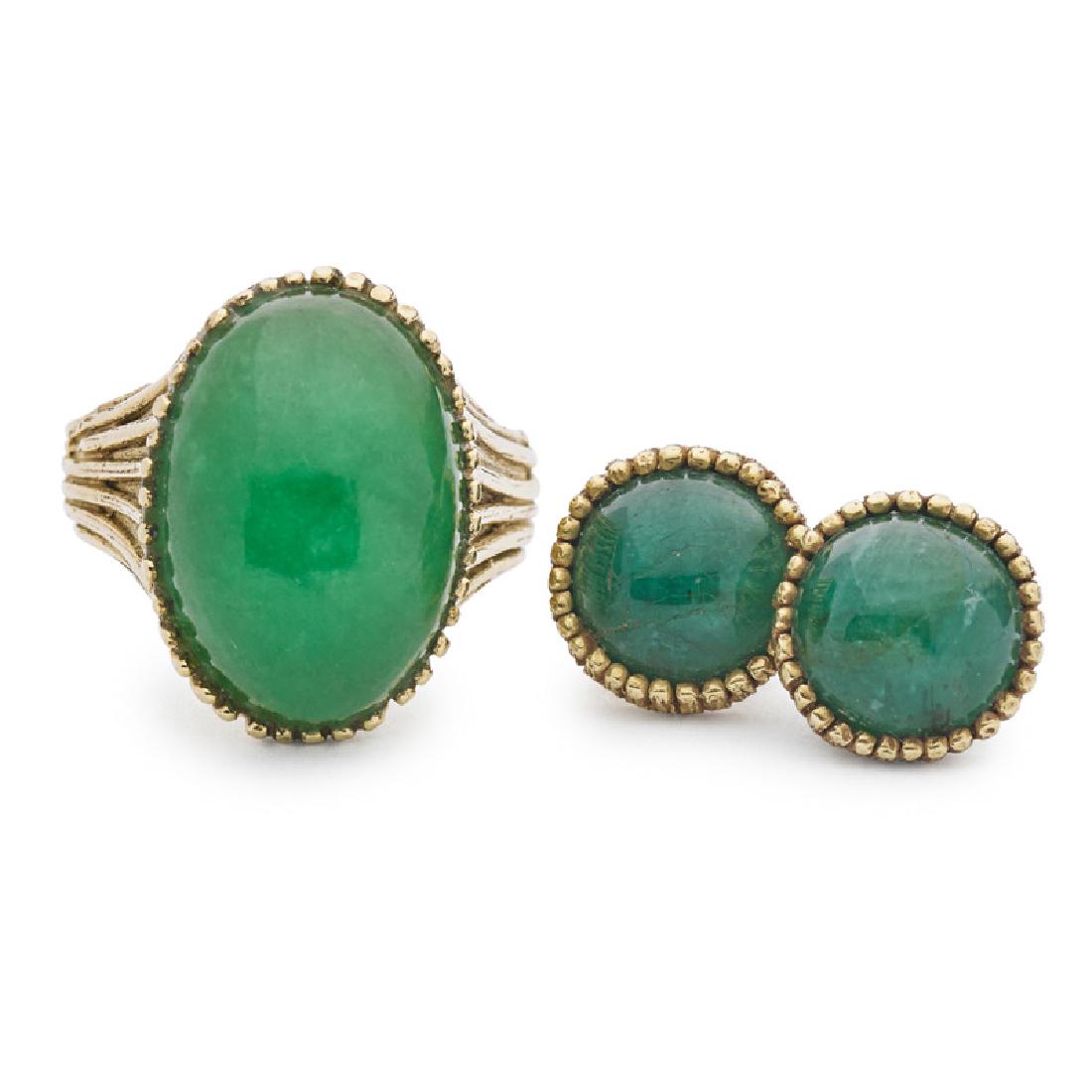 ED WIENER JADE RING & EMERALD EARRINGS: An oval dyed jade cabochon and fluted yellow gold ring; A pair of round emerald cabochon and yellow gold stud earrings. 18k. Unmarked. Ring size 7 (with sizing beads). 12.4 dwt.