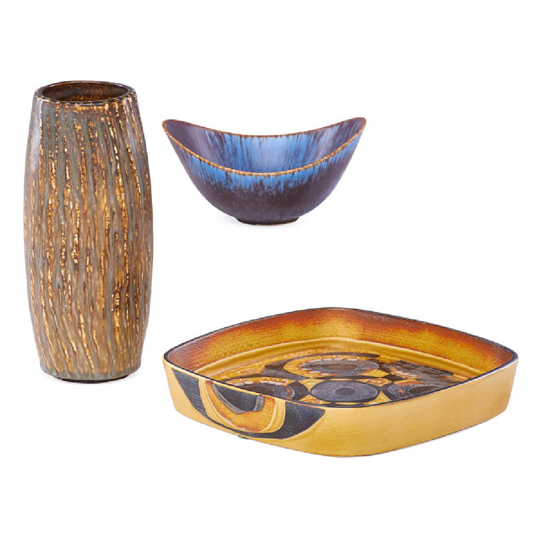 GUNNAR NYLAND FOR RORSTRAND, ETC.: Three: A sloped ceramic porcelain bowl, 4" x 6 1/2" x 3" and a cylindrical vase, 8 1/2" x 4" dia., both marked by Gunnar Nyland for Rorstrand, Sweden, mid 20th c., along with a rustic faience dish by