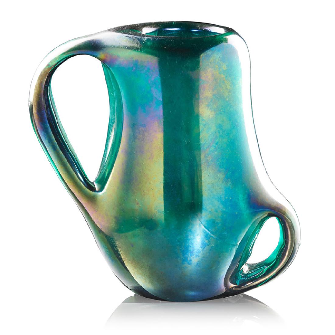 GIORGIO FERRO Anse Volante glass vase: GIORGIO FERRO (b. 1931) A.Ve.M. Anse Volante vase, Murano, Italy, 1950s Iridized glass Unmarked 8 1/4" x 8 1/2" x 4 1/2"