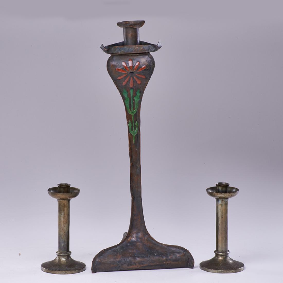 ROYCROFT; THE ARTCRAFTS SHOP: Pair of Roycroft candlesticks and Artscrafts Shop tall candlestick, East Aurora, NY, early 20th c. Silver-washed and enameled copper Orb and cross marks Tallest: 18" x 8" x 8"