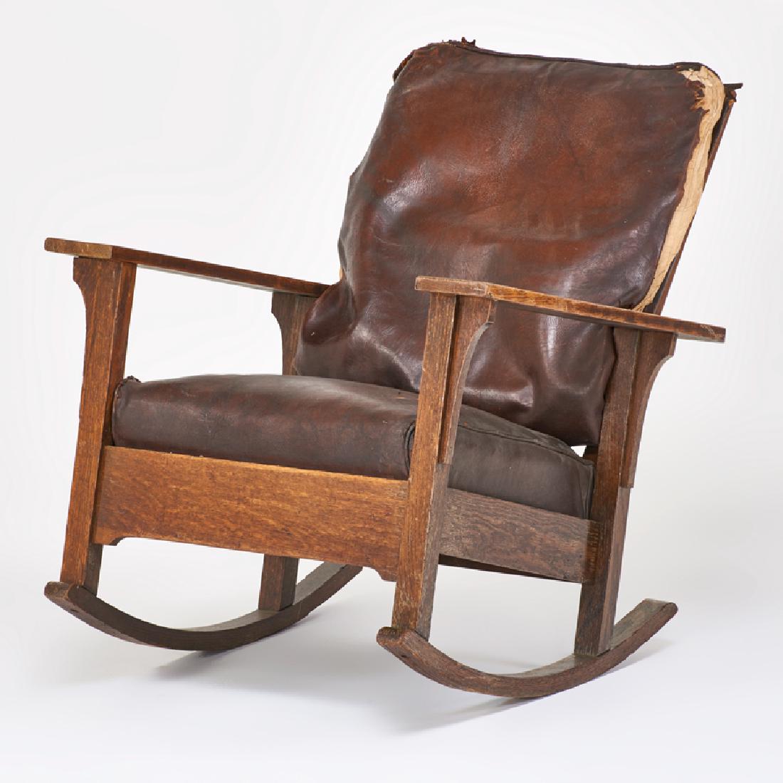 ARTS & CRAFTS: Open-arm Morris rocker, USA, ca. 1915 Quartersawn oak, leather Unmarked As shown: 37" x 34" x 30"