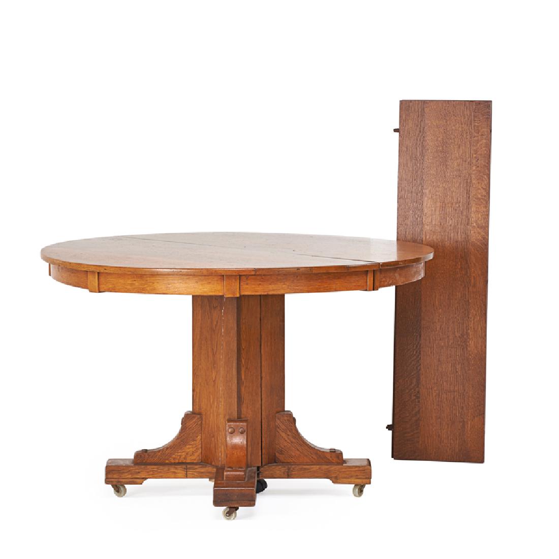 STICKLEY BROTHERS: Split pedestal dining table, Grand Rapids, MI, ca. 1915 Quartersawn oak Quaint metal tag 30 1/2" x 48" dia.