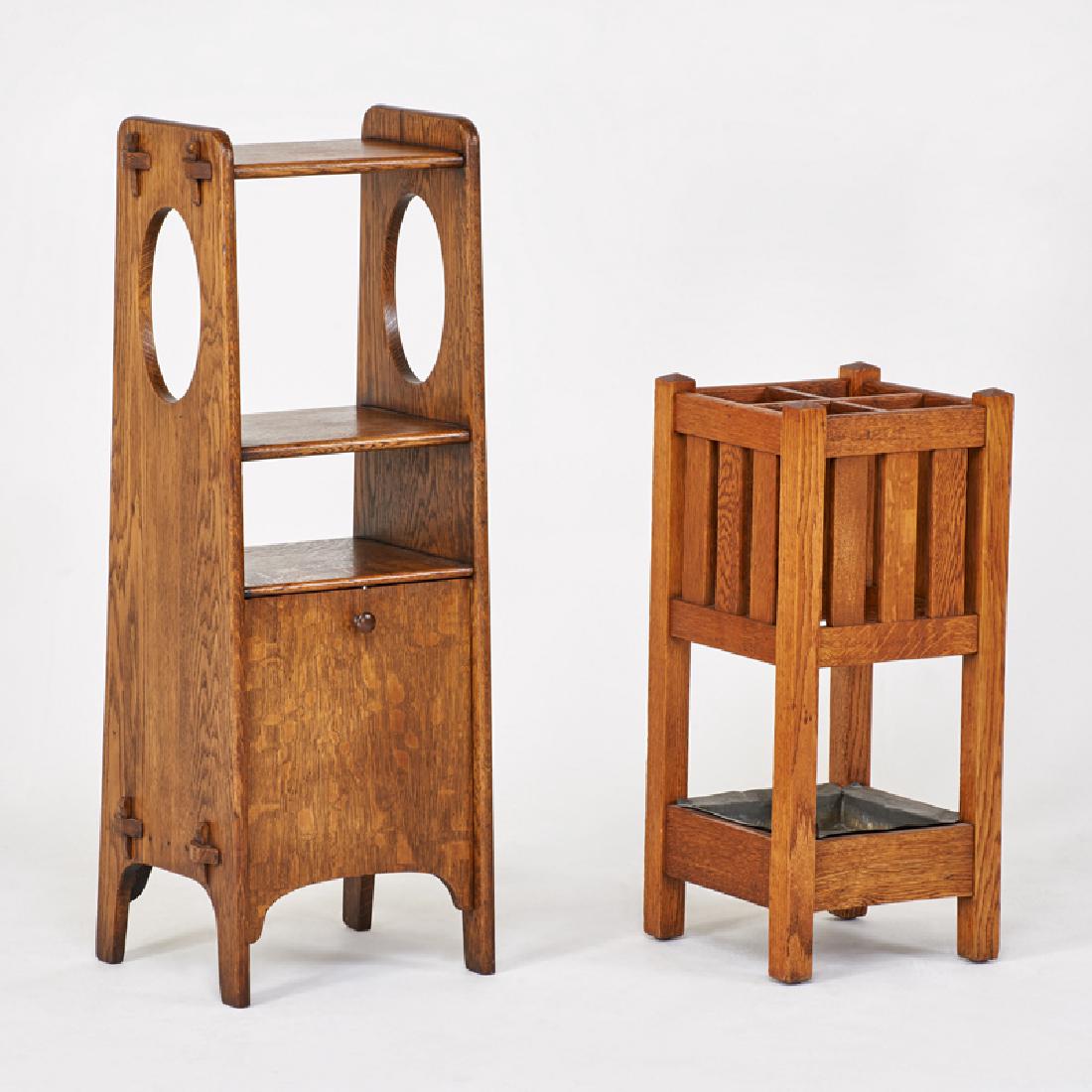 ARTS & CRAFTS: Magazine stand with oval cut-outs and integrated drop-front record cabinet, and similar umbrella stand, USA, ca. 1915 Quartersawn oak, patinated metal, galvanized metal drip pan Unmarked Magazine stan