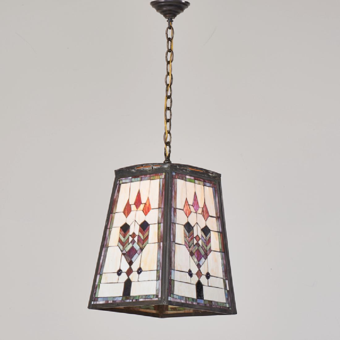 ARTS & CRAFTS: Hanging pendant with four leaded glass panels in geometric design, 20th c. Iron, slag glass Unmarked To ceiling cap: 35" x 12" sq.