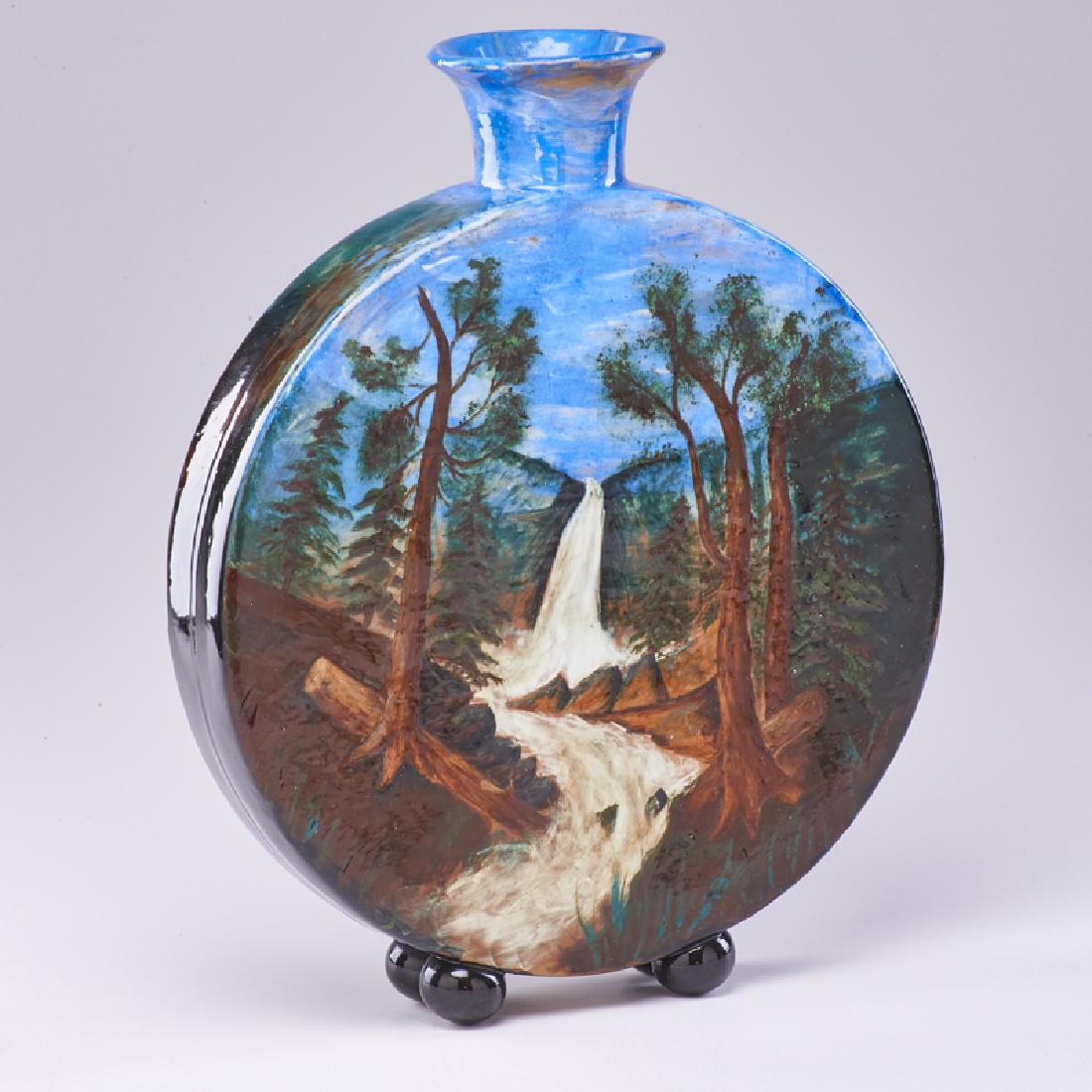 ROOKWOOD: Early barbotine pillow vase with forested waterfall scene, Cincinnati, OH, 1884: Stamped A/ROOKWOOD, date, and model 14 3/4" x 12" x 3 1/2"