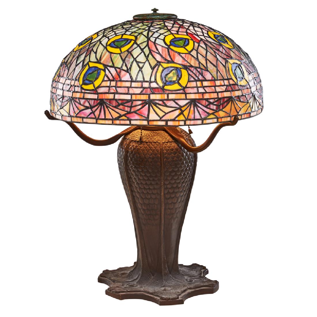 STYLE OF TIFFANY STUDIOS: Contemporary peacock table lamp, late 20th c. Leaded slag glass, patinated brass Unmarked 25" x 18" dia.