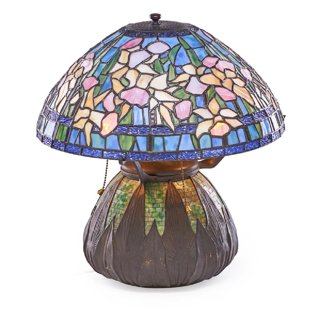 STYLE OF TIFFANY STUDIOS: Contemporary "Jonquil" table lamp with mosaic and stylized leaves on base, late 20th c. Leaded slag glass, textured glass, patinated brass Unmarked 17 1/2" x 16" dia.