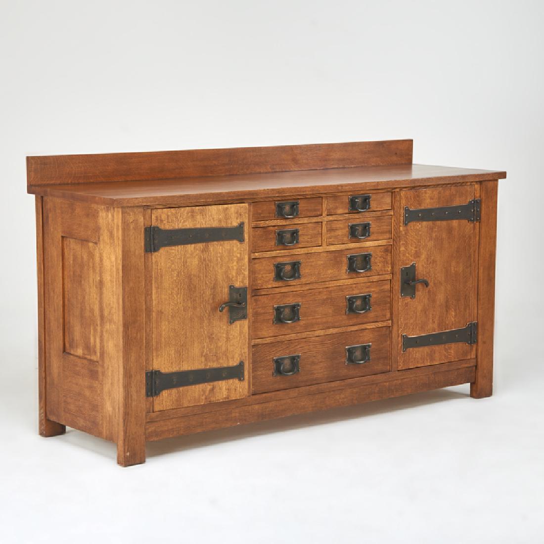 STICKLEY; E.J. AUDI: Contemporary sideboard in the style of Gustav Stickley with gallery top, and seven drawers flanked by two cabinet doors, Manlius, NY, 2000s Quartersawn oak, patinated metal Metal tag, branded mark 44