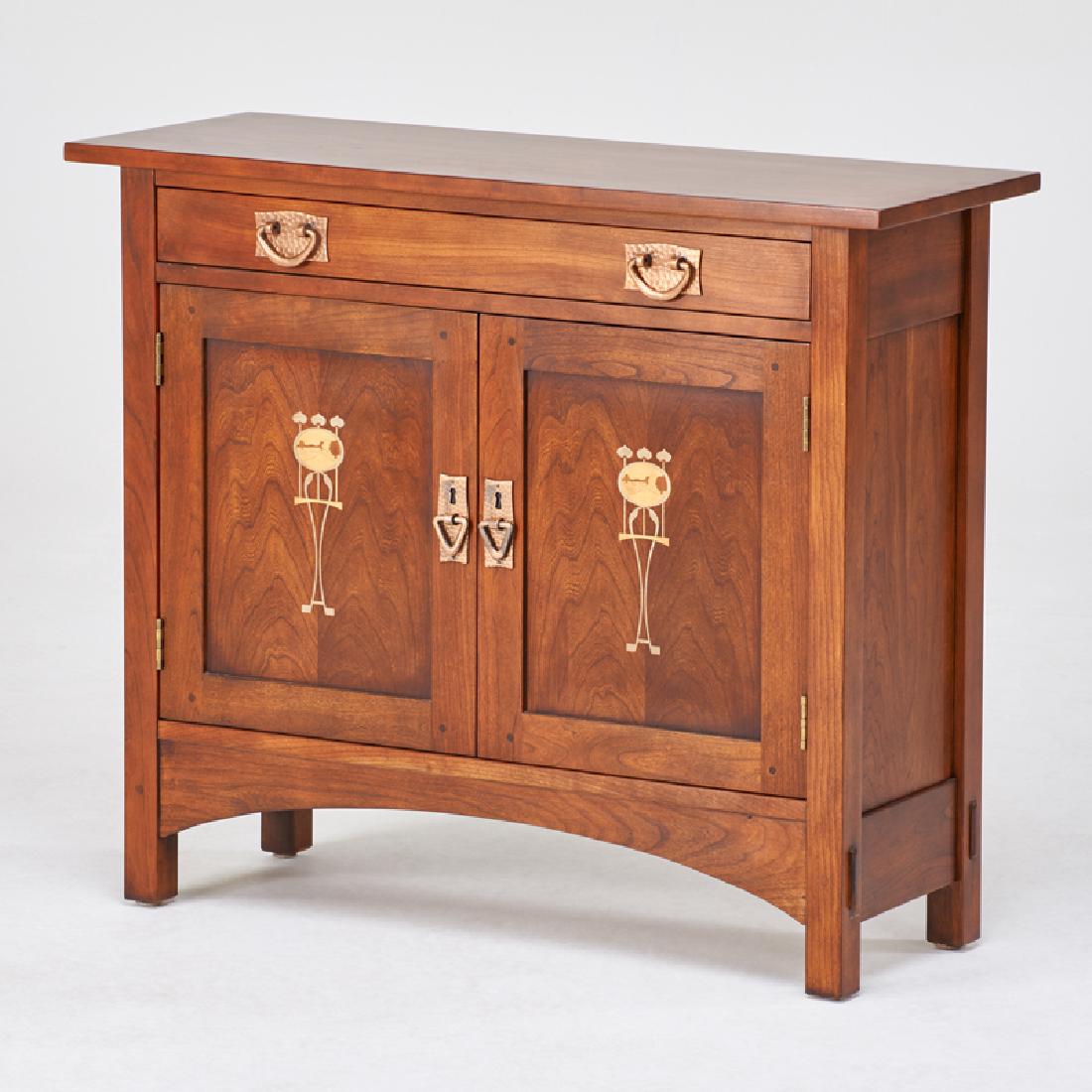 STICKLEY; E.J. AUDI: Contemporary collector's edition cabinet in the style of Harvey Ellis, single drawer over two doors and decorative inlay, Manlius, NY, 2001 Cherry, hardwood inlay, patinated metal hardware 30" x 36" x