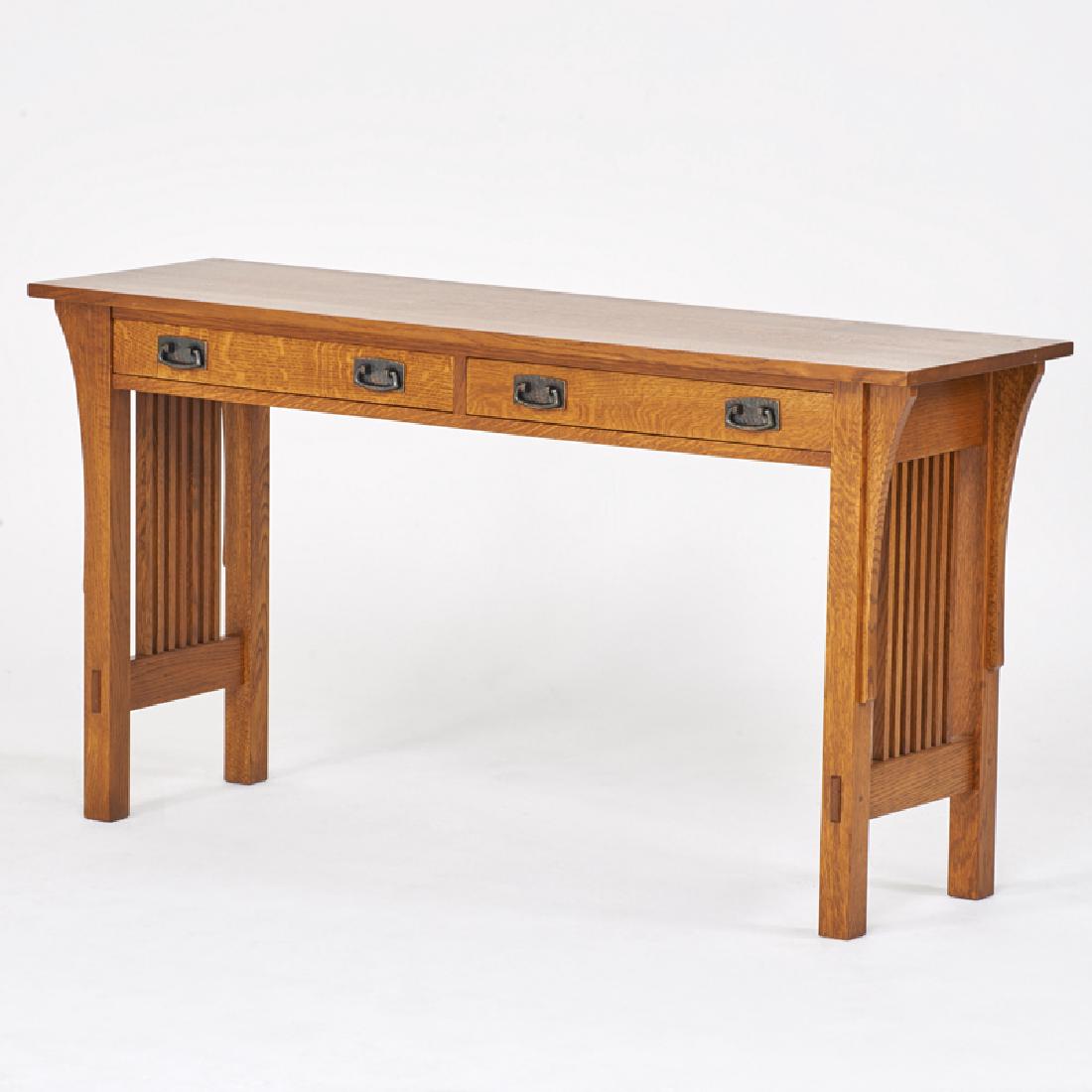STICKLEY; E.J. AUDI: Contemporary spindled two-drawer console table, Manlius, NY, 2000s Quartersawn oak, patinated metal Metal tag, branded mark 28 1/2" x 54" x 16"