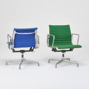 CHARLES & RAY EAMES; HERMAN MILLER: Pair of Aluminum Group tilt/swivel armchairs, Zeeland, MI, 1970s Polished aluminum, enameled steel, upholstery Manufacturer marks 31" x 23" x 23"