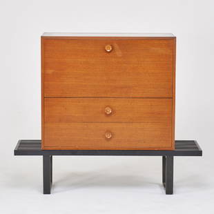 GEORGE NELSON; HERMAN MILLER: Drop-front desk, raised on slat bench, Zeeland, MI, 1950s Walnut, chromed steel, enameled wood Desk: 34" x 40" x 19 1/2", bench: 14" x 56 1/2" x 18 1/2"