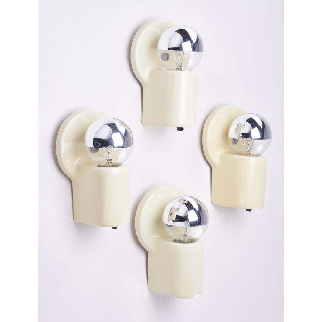 WILLIAM LESCAZE (1896-1969); PASS & SEYMOUR: Set of four sconces, New York, 1930s Glazed porcelain, Bakelite, brass, single sockets Manufacturer's mark 7 1/4" x 4 3/4" x 4"