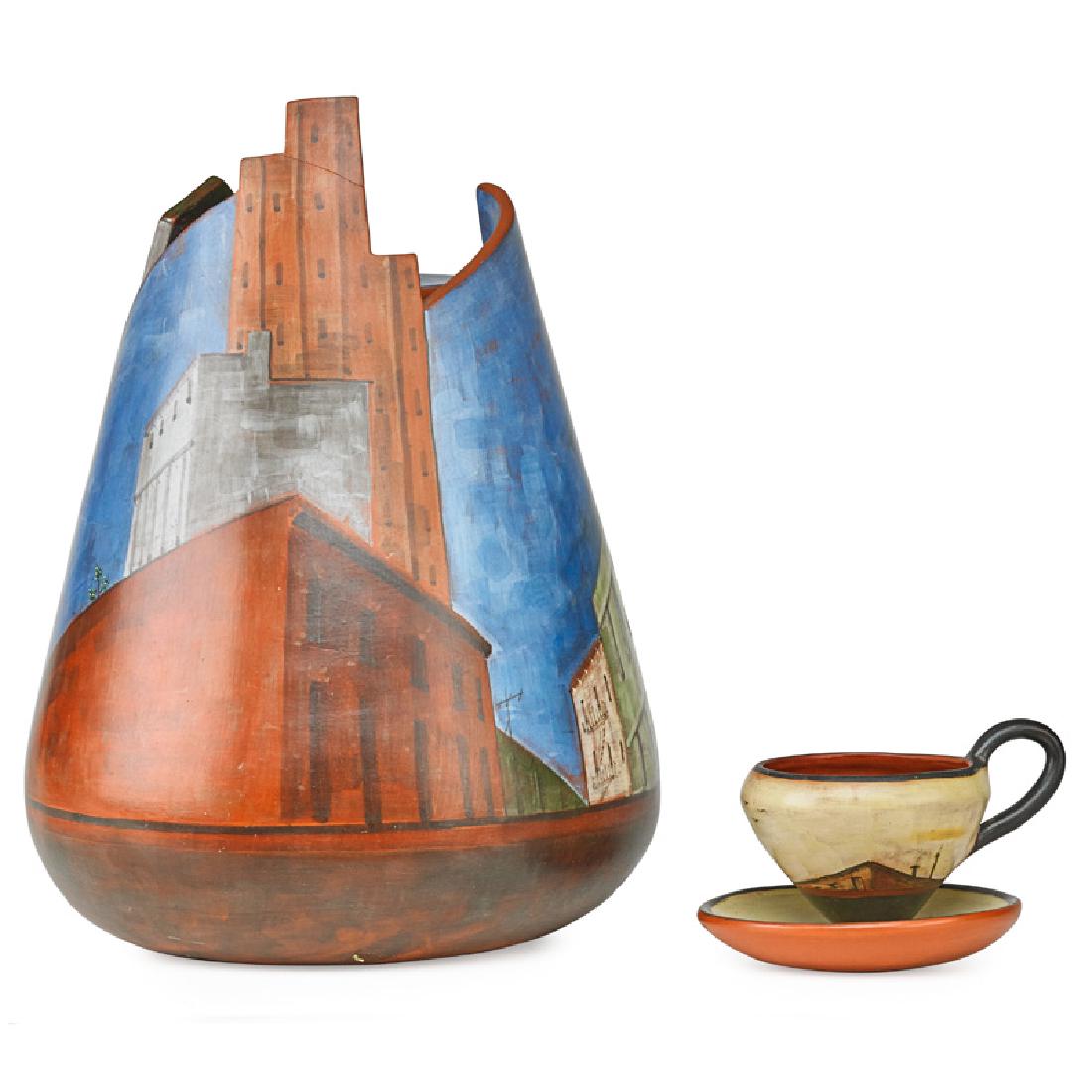 LIDYA BUZIO CITYSCAPE POTTERY: Large vessel with teacup and saucer Teacup initialed and dated, vessel signed "L. Buzio, 1982, NYC" 13 1/2" x 9" dia.
