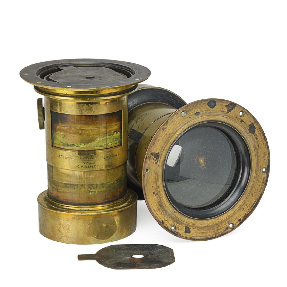 TWO EARLY PORTRAIT PETZVAL CAMERA LENSES: Each brass, one engraved "Ross, No. 3 Cabinet, London" with serial number 29245, the other German, engraved "Euryscop IV No. 7, Voigtlander & Sohn, Braunschneig" with serial number 49450, along with t