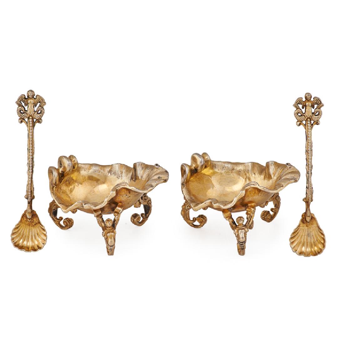 PAIR OF SILVER-GILT SALT CELLARS: Shell form on figural supports with figural spoons and shell form bowls, Continental, 19th c. Marked "13" 2" x 3 1/4" 9 ozt