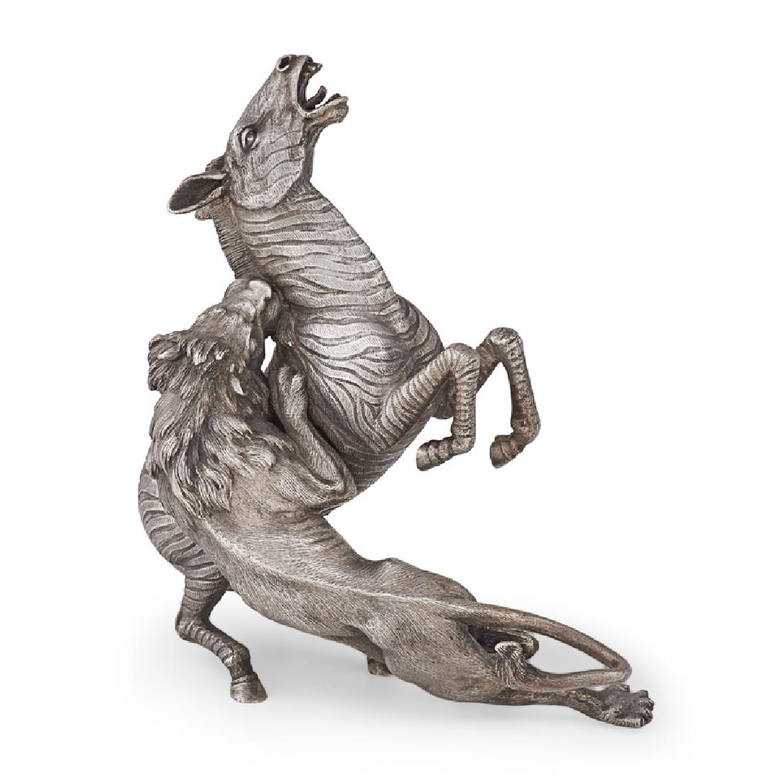 MARIO BUCCELLATI SILVER ANIMALS: Lion attacking a zebra, .800 silver, Italy, 20th c. Marked "M. BUCCELLATI" 8" x 7" x 4" 44.6 OT