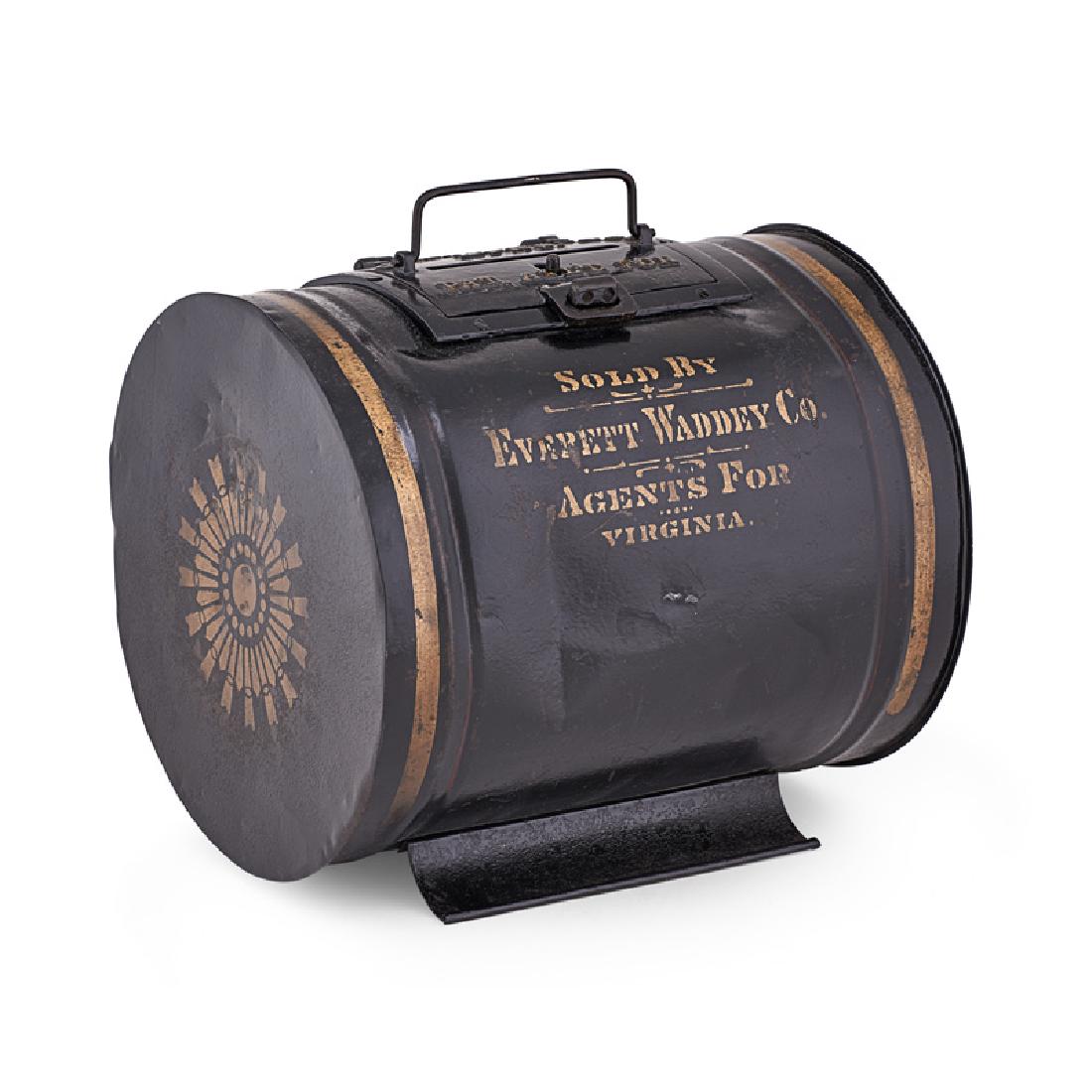 MULE-MOUNTED BALLOT BOX: Barrel-shaped tin box with black painted surface and gold stencils, slotted and latched cast iron lid and bale handle, USA, 19th c. Marked "GEO. D. BARNARD & CO. MFR'S" and "SOLD BY EVERETT WADDEY CO.