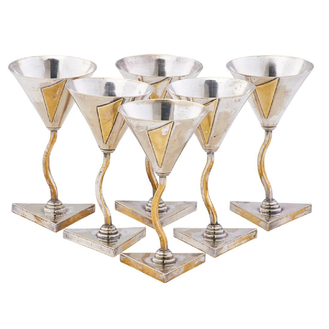 ELSA TENNHARDT Six Art Deco cocktail glasses: ELSA TENNHARDT (1899 - 1980) E. & J. BASS CO. Set of six rare Art Deco cocktail glasses, New York, ca. 1928 Silver-plated brass All stamped E. & J.B. 5" x 2 3/4" ea. Exhibition: Examples of this form
