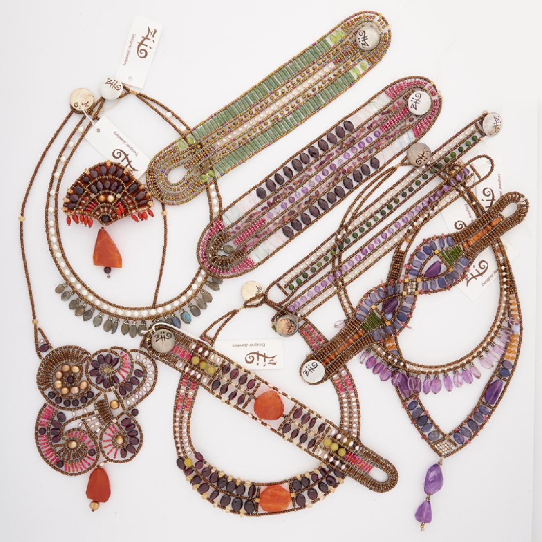 COLLECTION OF ZIIO BEADED GLASS OR GEMSTONE JEWELRY: Comprising fourteen necklaces, ten strap bracelets and one brooch from the Fenice Amethyst, Riviere Viola, Riviere Pearl, Magma Sundelight, Magma Fire, Butterfly Cornaline, Sontuoso Pearl, Sontuoso Vi