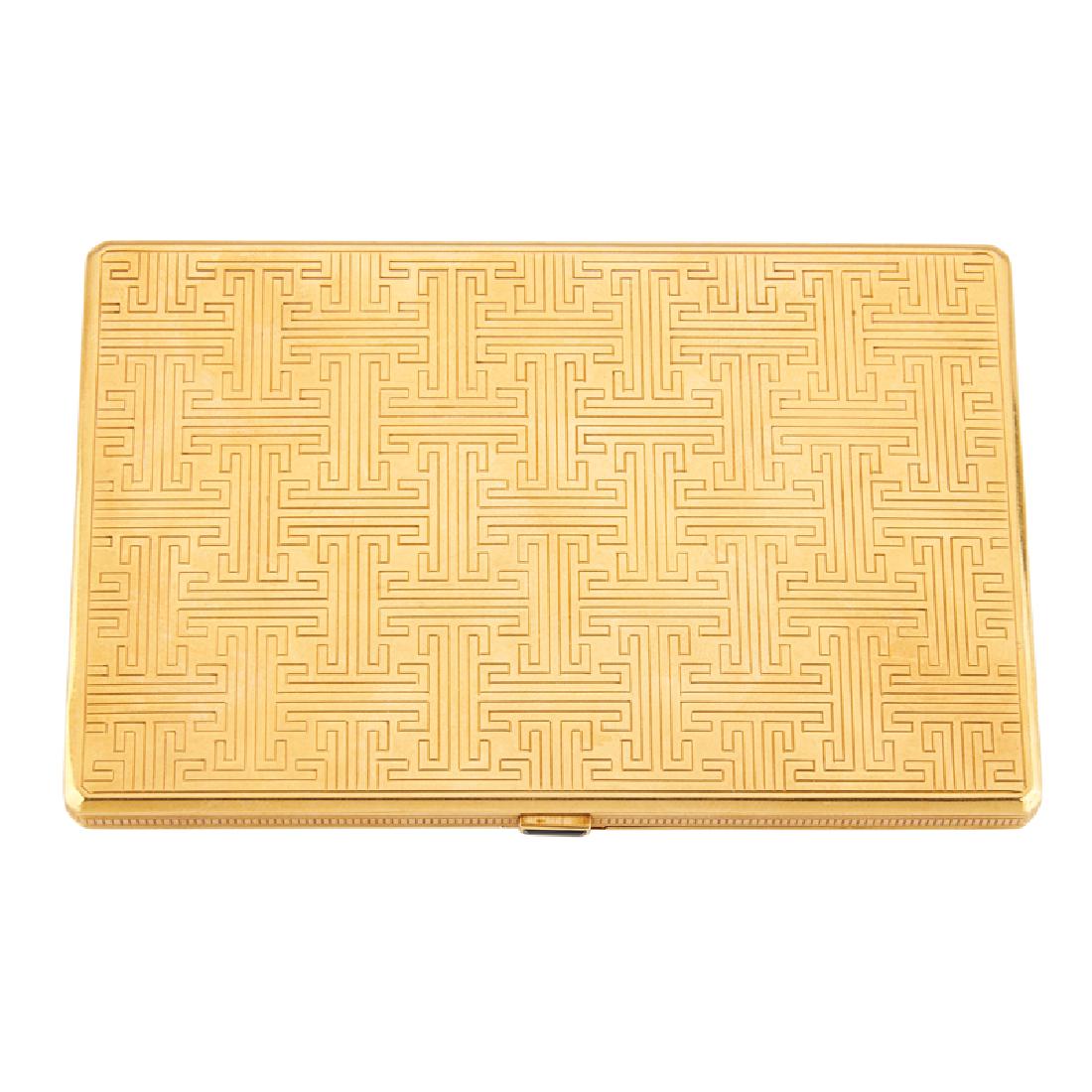 CARTIER FRANCE YELLOW GOLD CIGARETTE CASE: The slim cut corner rectangular case engraved to both sides with geometric pattern, calibre-cut sapphire thumb press. 18k. Stamped Cartier 62055 with French control marks. 3 3/8" x 5 1/8" x 3/8". 161.