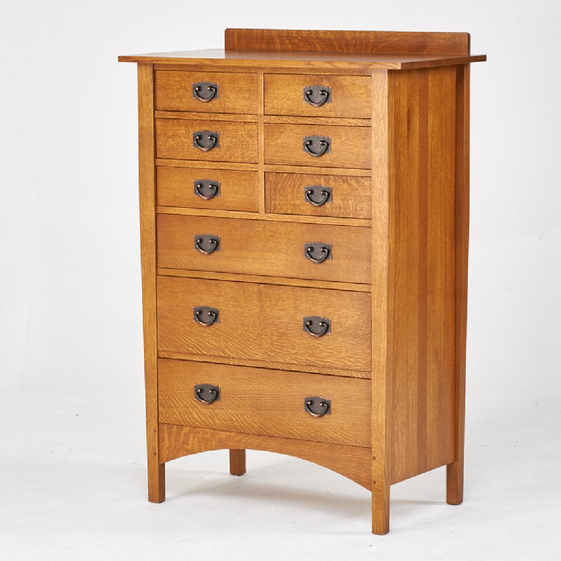 STICKLEY; E.J. AUDI: Contemporary nine-drawer chest, in the style of Harvey Ellis, Manlius, NY, 2000s Quartersawn oak, copper patinated metal Metal tag, branded mark 55 3/4" x 38" x 20"