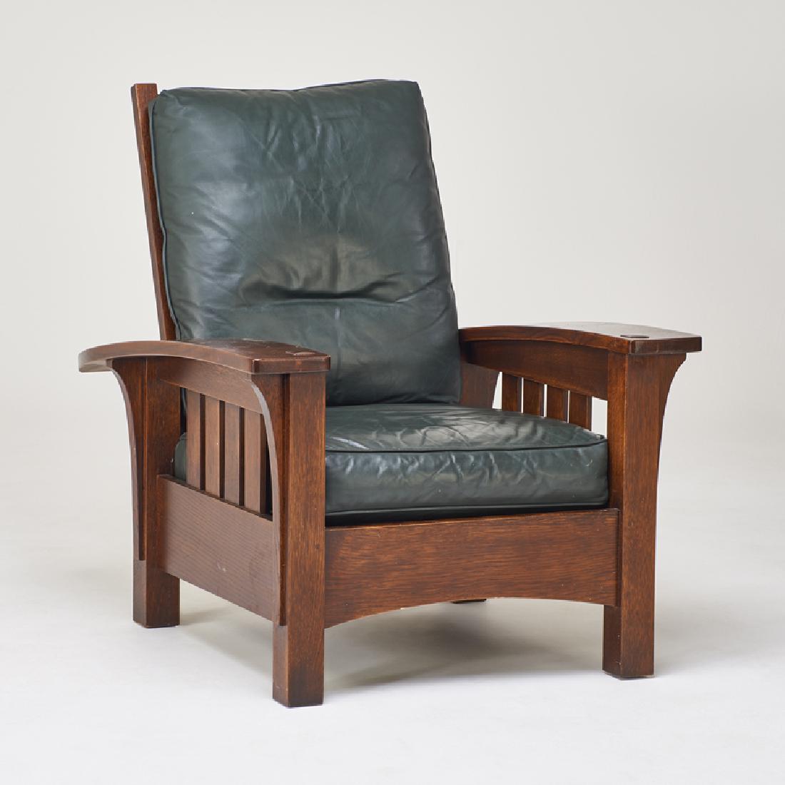 STICKLEY; E.J. AUDI: Contemporary bow-arm Morris chair in the style of L. & J.G. Stickley, Manlius, NY, 2000s Quartersawn oak, leather, down-filled upholstery Metal tag and branded mark 39 1/2" x 34 1/2" x 41"