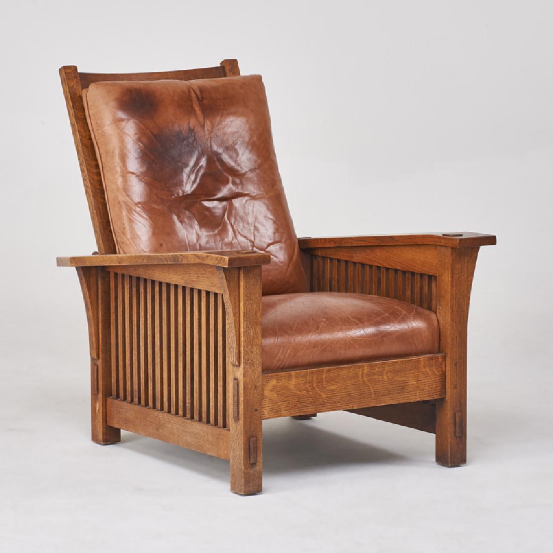 STICKLEY; E.J. AUDI: Contemporary drop-arm spindled Morris chair in the style of L. & J.G. Stickley, Manlius, NY, 1990s Quartersawn ak, leather Branded mark, metal tag 39 1/2" x 33" x 38"
