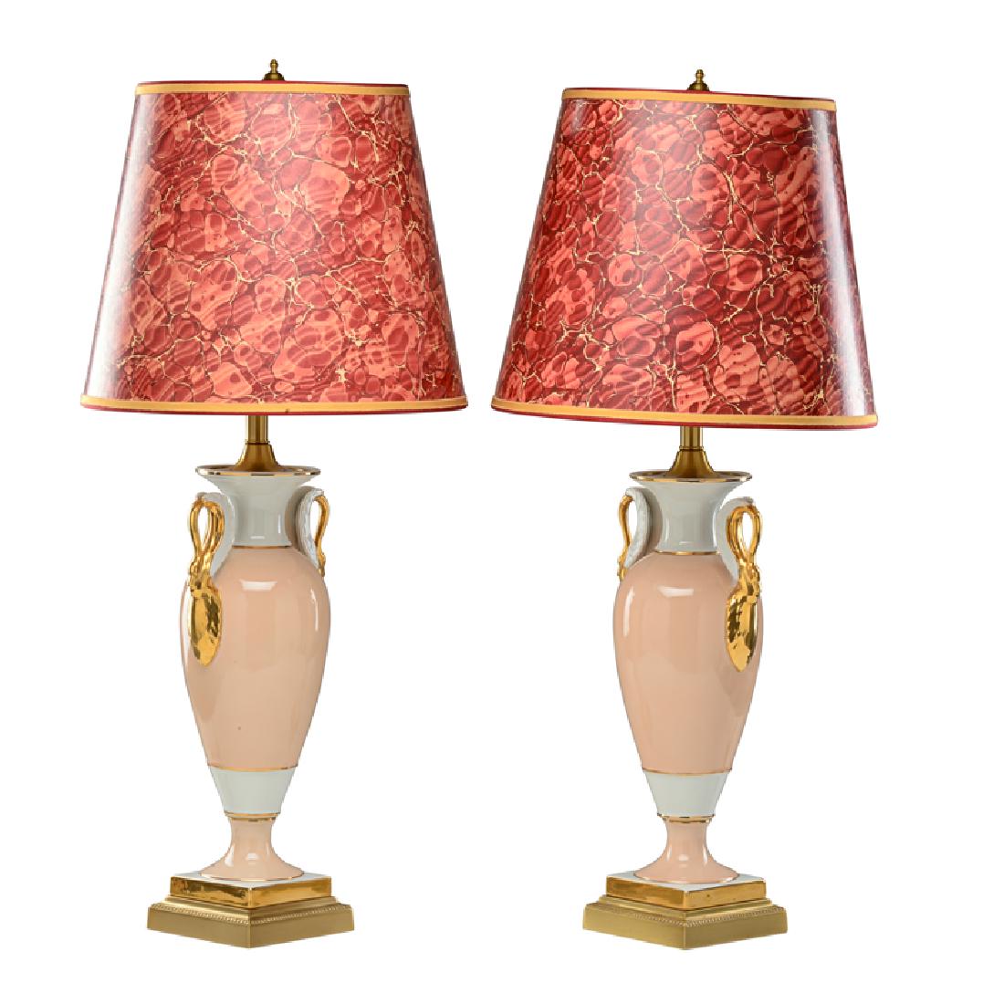 FREDERICK COOPER: Pair of urn table lamps with swan handles, paper shades with embroidered trim Chicago, IL Glazed ceramic, brass, Both labeled 29 1/2" x 13" dia.