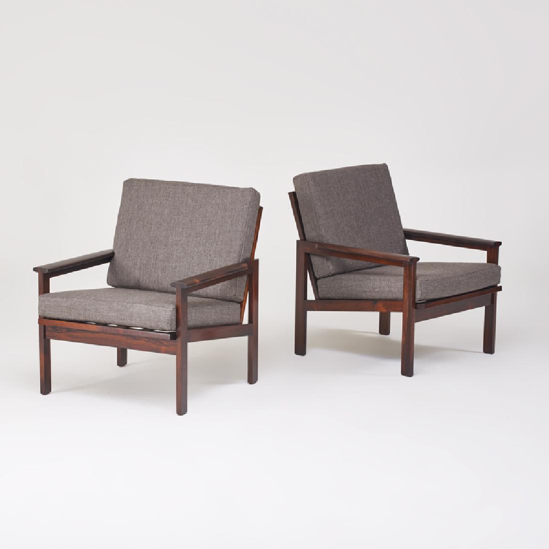 NIELS EILERSEN: Pair of lounge chairs, Denmark, 1960s/70s Rosewood, upholstery Maker labels 31" x 27" x 30"